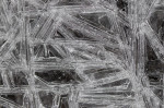 © Peter Robinson  <em>Long Ice Crystals on Moving Water</em>